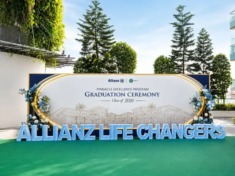 Custom printed graduation ceremony backdrop with gold frame, floral accents and LED letters in Singapore